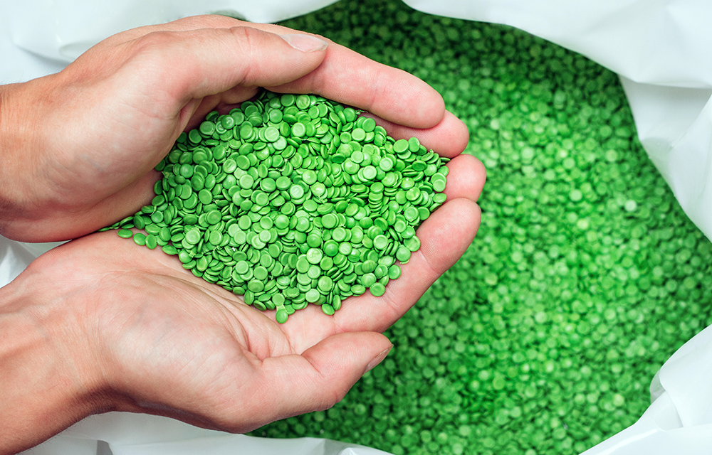 hands hold or touching biodegradable plastic pellets, plastic po