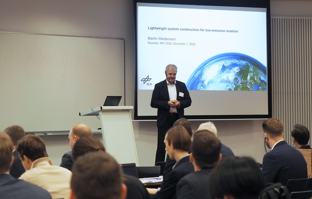 Martin Wiedemann delivered the keynote address at MIC 2022 on the topic of "Lightweight system construction for low-emission aviation"